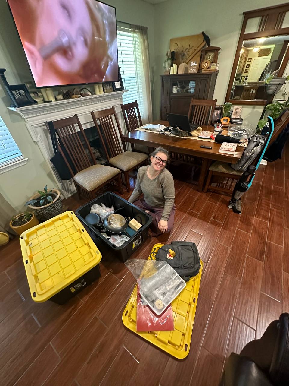 Woman Comfortably Packing Boxes Indoors While Wearing the Breathable Yak Wool Boat Neck Sweater - Oliver Charles